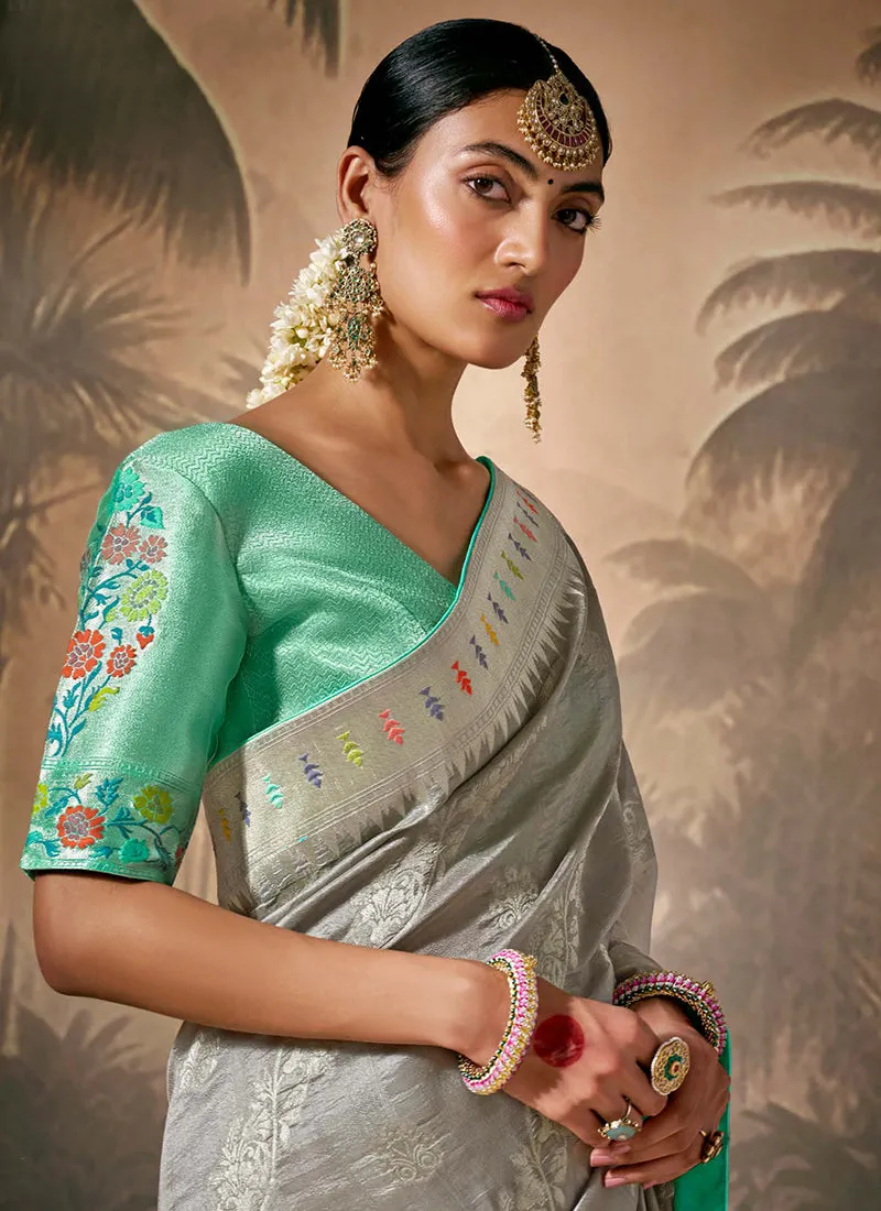 Grey And Teal Floral Munga Silk Saree